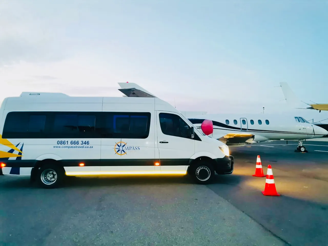 Compass Travel branded vehicles at a Cape Town venue