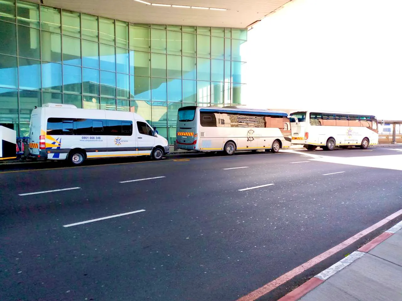 Compass Travel branded vehicles at a Cape Town venue
